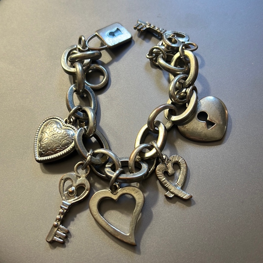 Silver bracelet with charms